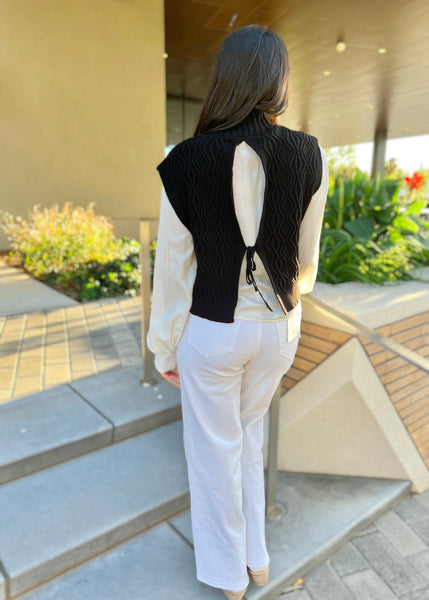 Beat Goes Black Sweater Vest Layered Over White Blouse