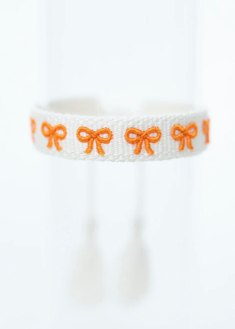 Sweet Caroline Orange Bows Woven Tassel Bracelet