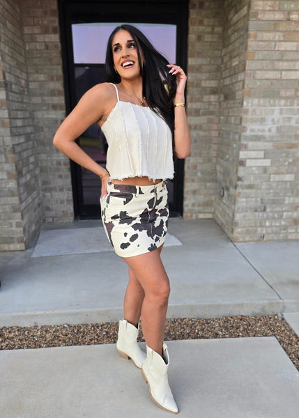 Herd Em Up Low Waisted Cow Print Mini Skirt - SMALL